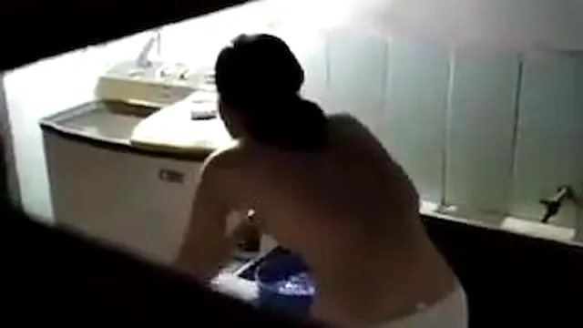 Horny Brunette Spied On In The Shower