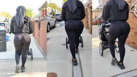 Mulher negra jamaicana empurrando um carrinho de bebê